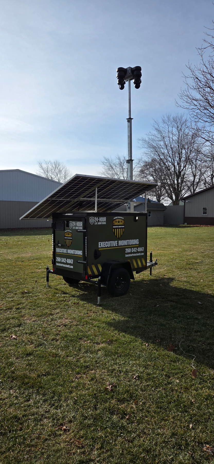 Executive Monitoring trailer deployed on a property, rear three-quarter view